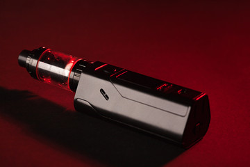 vaping device mod on dark background