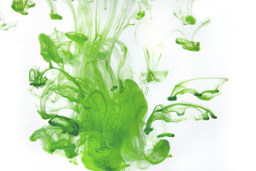 Color paint drops in water. Ink swirling underwater.