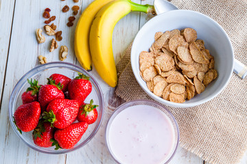 Healthy Breakfast which included cornflakes and oatflakes, yogurt, bananas and strawberries