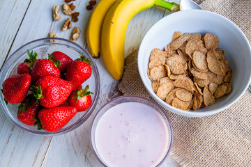 Healthy Breakfast which included cornflakes and oatflakes, yogurt, bananas and strawberries