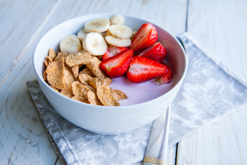 Healthy Breakfast which included cornflakes and oatflakes, yogurt, bananas and strawberries