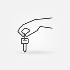 Hand holding car key icon