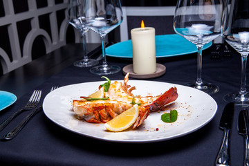 Lobster tail in maple-truffle sauce with lemon and basil