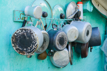 Pots, pans, lids and pots on the wall