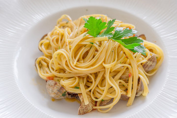 Close up Italian seafood pasta in white plate