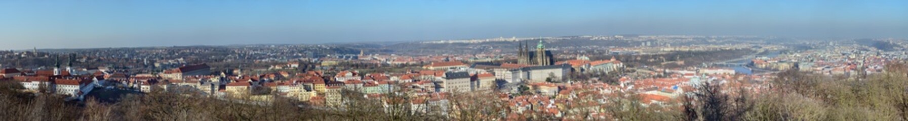 Naklejka na ściany i meble Panorama of Prague in sunlight of winter afternoon, Czech Republic.