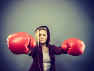 Woman wearing boxing gloves