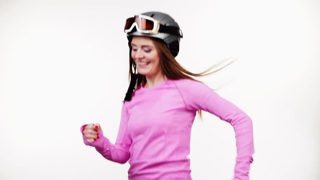 Woman happy fit female wearing ski gear and pink thermal underwear long sleeves top apparel for skiing, training warming up. Clothing sport wear concept, on white studio shot, full HD.