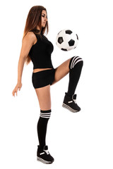 Beautiful young woman with a football