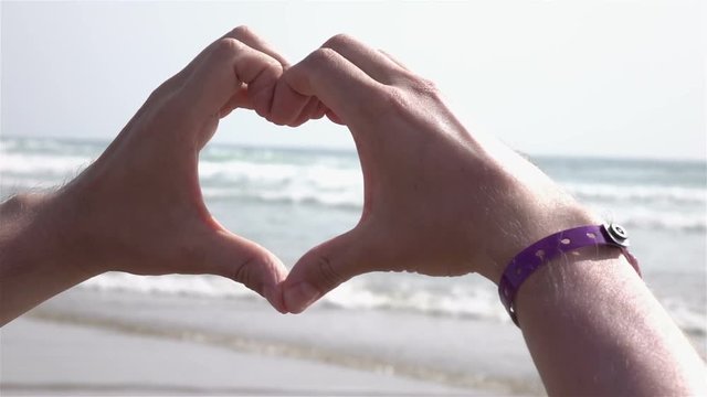 High quality video of symbol of love by the ocean in real 1080p slow motion 250fps