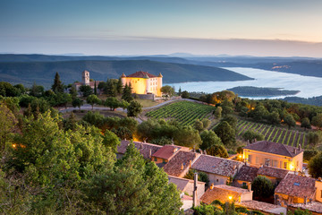 View of Aiguines village with charming chateau and church overlooking Lac de Sainte Croix Lake, Var department, Provence, France - 164413593