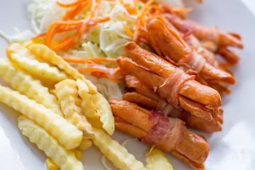 Sausages wrapped with bacon