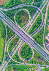 Aerial view, Road roundabout, Expressway with car lots in the city in Thailand.  beautiful Street , downtown, cityscape, Top view. Background