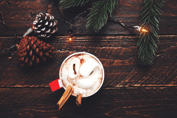 Christmas background - Cup of hot chocolate on wood table with rustic decoration and copy space, flat lay, top view. vintage color tone style.