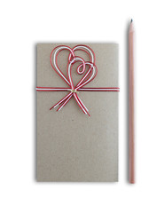 blank greeting card with red hearts and ribbon on a white background for Valentine day