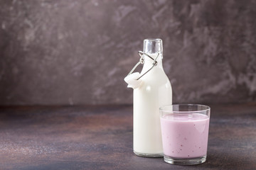 Milk, yogurt  against a dark background. Selective focus. Copy space