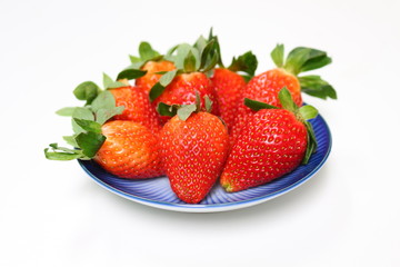 Group of strawberries on dish