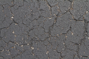 cracked dark pavement