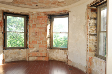 Fototapeta na wymiar old building with interior naked brick wall need repair
