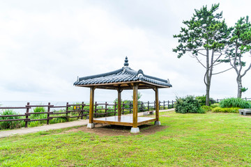 Fototapeta na wymiar Korean Pavillian at Jeju-do Oedolgae Rock Park in Jeju Island