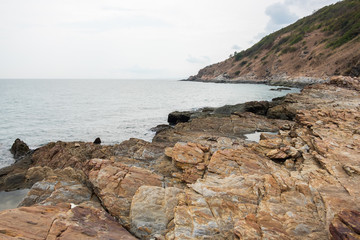 Fototapeta na wymiar Coastline with view of mountain cape