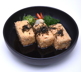 Japanese Crispy deep fried Tofu or Agedashi Tofu served in tentsuyu broth isolated on white background (clipping path)