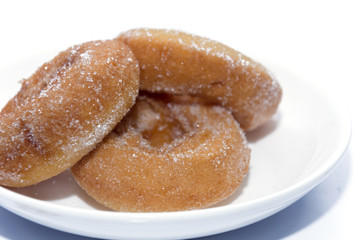 donut on white plate isolated on white