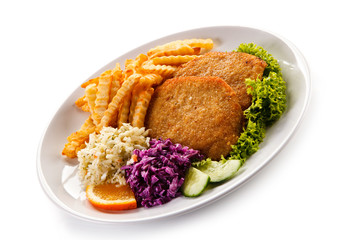 Fried pork chop, French fries and vegetables 