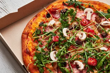 Fotobehang Pizzeria Tasty pizza in cardboard box.
