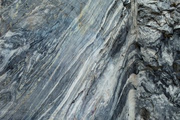 A large rock of grey marble. The texture of the marble. Natural Stone pattern. Natural Stone texture. Natural Stone background. Porcelain textures.