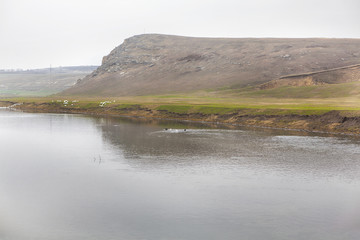 hill and river water