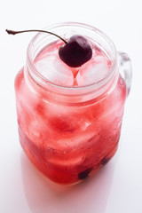 Red drink with ice, cherry. © ytochka89