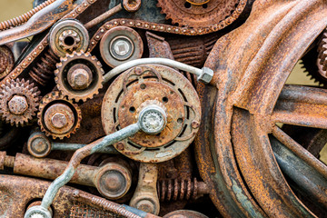 old corroded metal gears and other scratched details of industrial machine