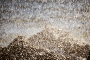 Natural sunny splashes on rocky shore outdoors seascape. Coastline abstract background