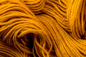 Close up the golden yellow yarn thread as abstract  background