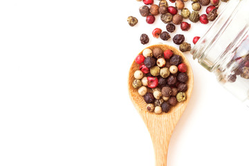 Close up mixed type of the peppercorns in wooden spoon , top view or overhead shot