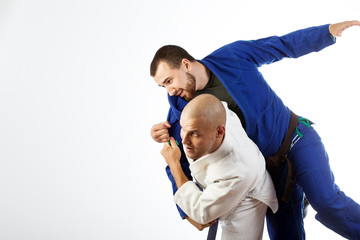 two men  fight judo