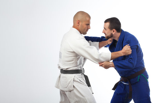 two men  fight judo