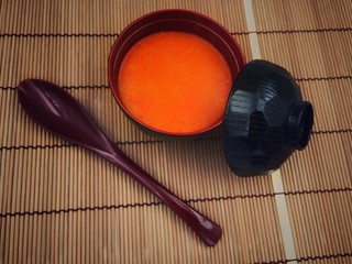 closeup soup bowl and spicy soup in bowl,in abstract art design,blurry light around.