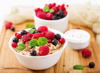 Tasty and healthy oatmeal porridge with berry, flax seeds and yogurt. Healthy breakfast. Fitness food. Proper nutrition