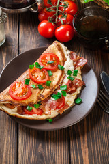 Omelette with bacon and tomatoes