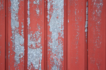 textured background of a fence with peeling paint