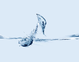 A blue musical note made of water floating on a music sheet line.