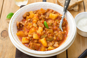 Potato stew with pork and white kidney beans