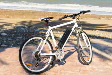 Fototapeta na wymiar Bicycle parked in the beach sand.