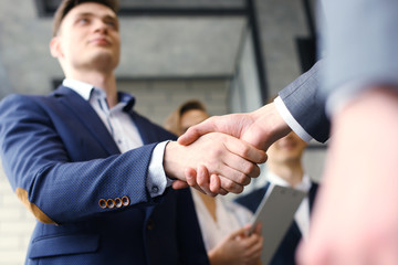 Business people shaking hands, finishing up a meeting.