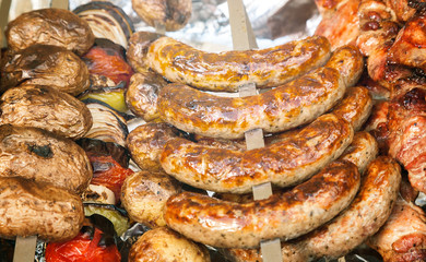 Fried sausages on metal skewer, selective focus