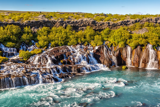 Fototapeta Hraunfossar waterfall in Iceland at sundown