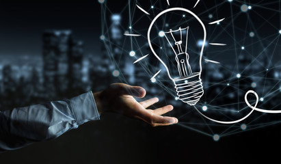 Businessman holding a sketch lightbulb