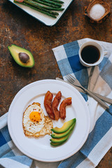 Breakfast. Fried eggs, asparagus, bacon and avocado.
